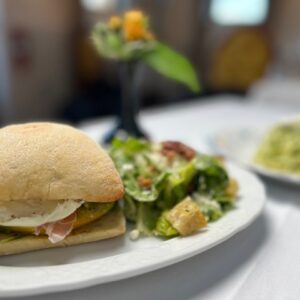 Manna - Caprese sandwich with a Caesar salad